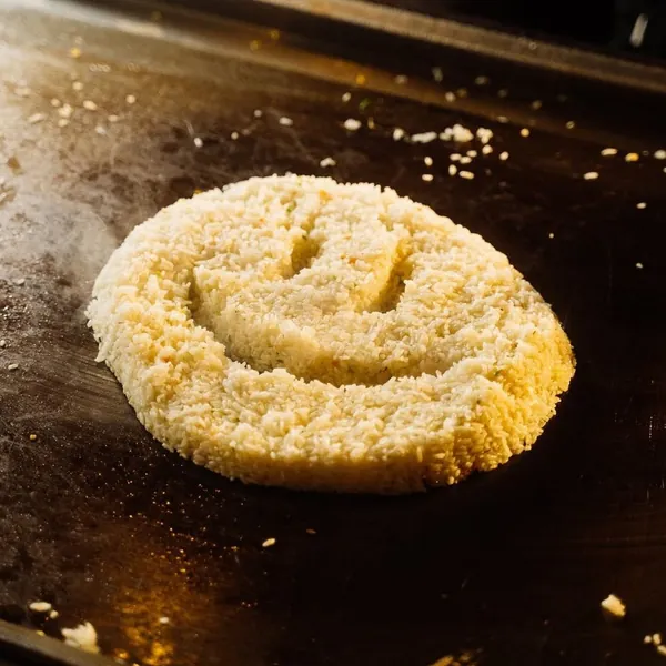 Smiley-face hibachi fried rice on the grill