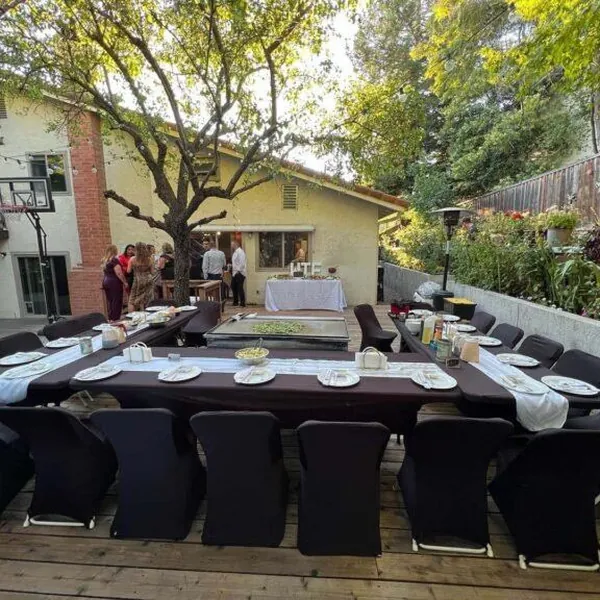 Hibachi dinner tables arranged on a backyard deck